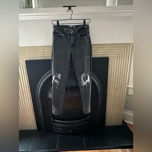 Levi’s black skinny jeans super distressed and slight paint staining size 28